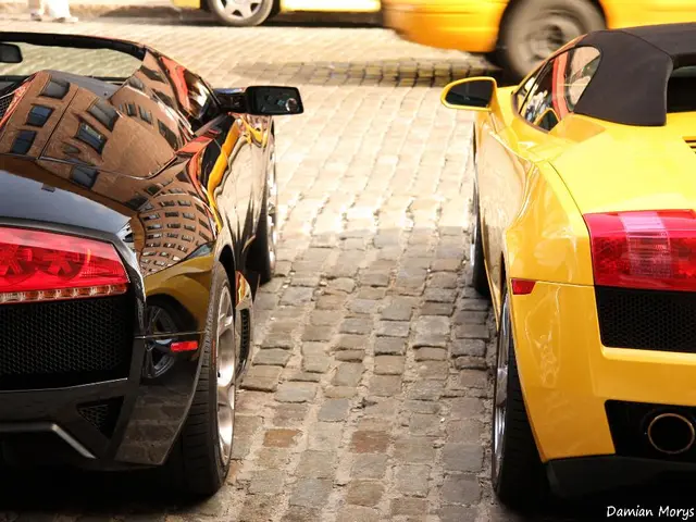 In this image I can see four vehicles and in the bottom right corner there is a watermark.