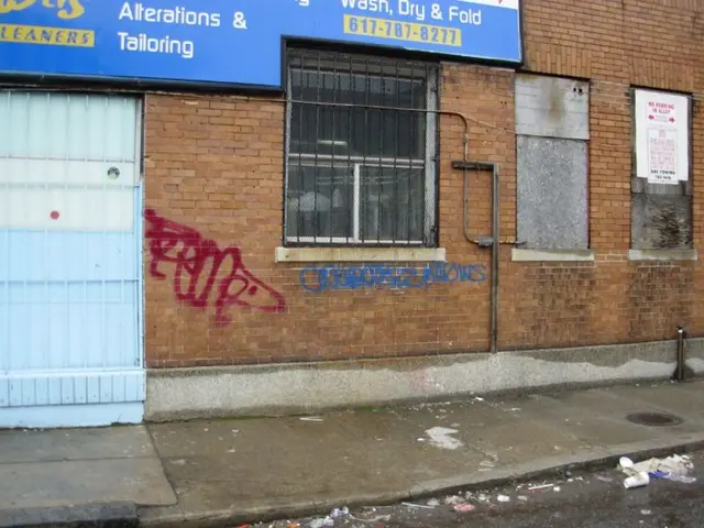 The picture is taken outside the street. At the bottom there is footpath and road, on the road...