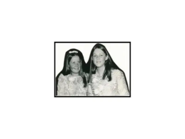 In this image we can see the black and white photography. In the photograph there are women.