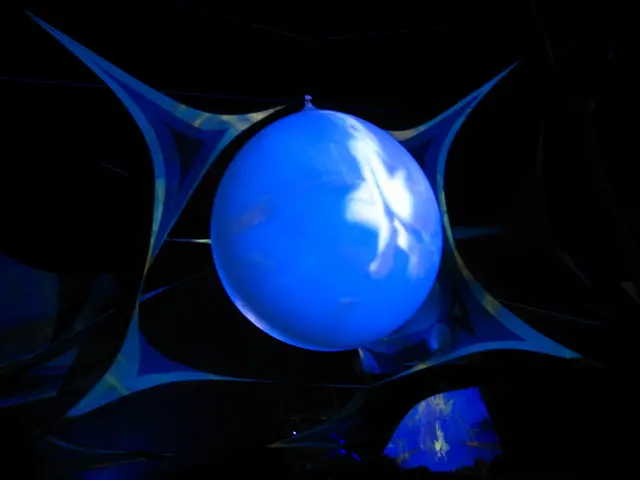 In this picture we can see a blue color balloon in the middle of the image.