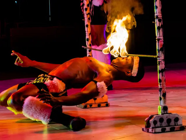 This person is looking at this fire. Fire is on the rod. This rod is attached to the poles.